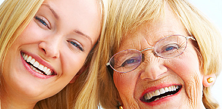 elderly woman and a woman smiling