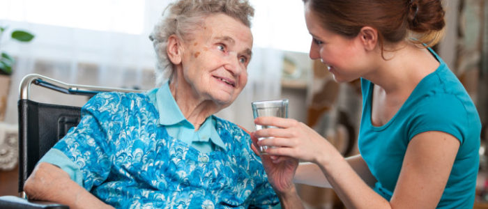 elderly woman and her caregiver